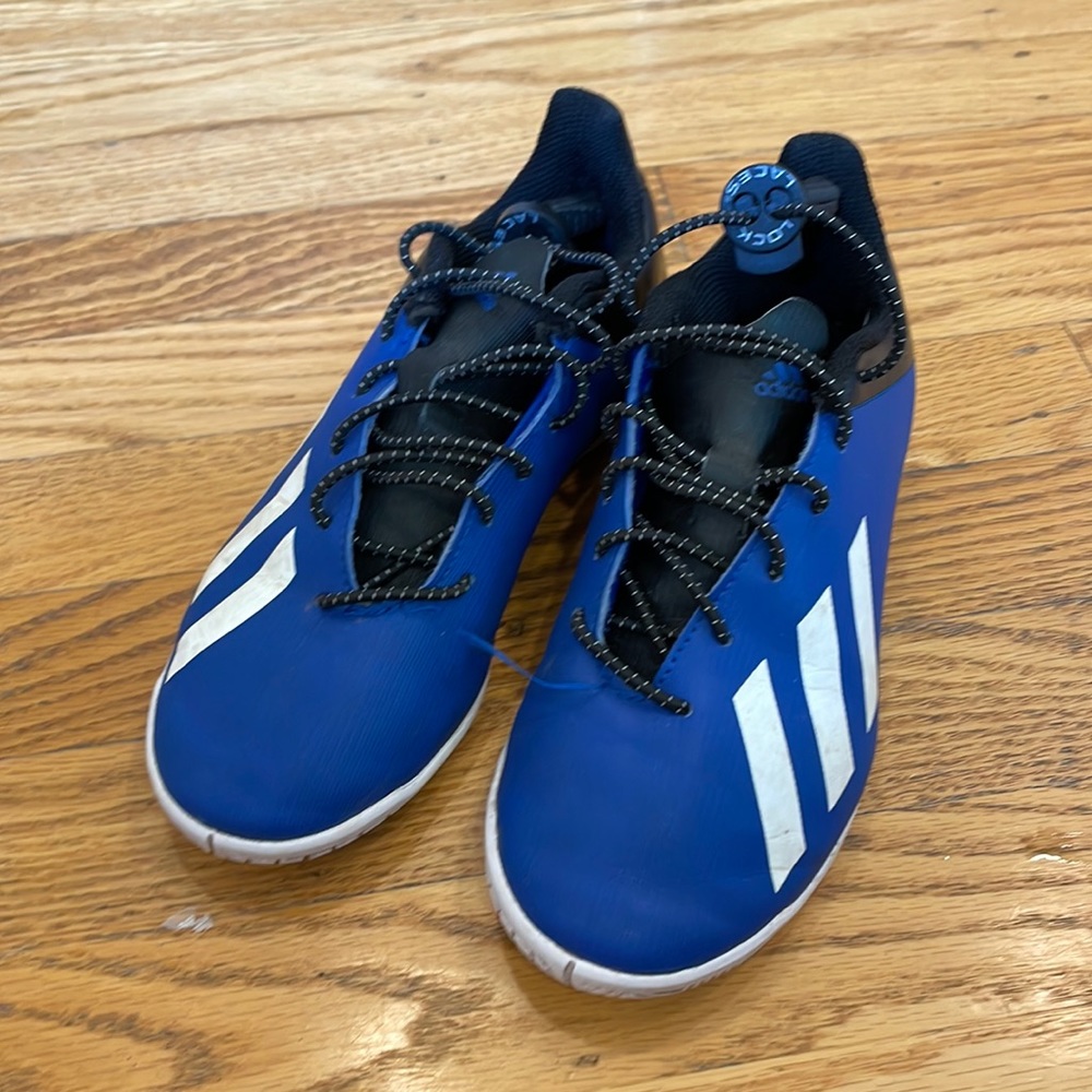 Adidas blue turf shoes with toggle